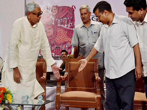 Delhi Chief Minister Arvind Kejriwal (R) with his Bihar counterpart Nitish Kumar at a felicitation function in New Delhi on Wednesday. PTI Photo
