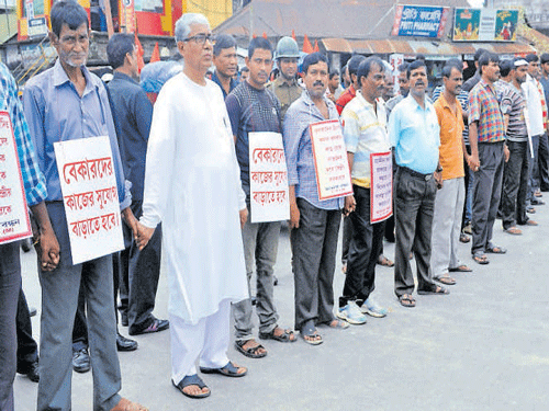 Tripura Chief Minister Manik Sarkar (2nd left) leads the protest in Agartala on Wednesday. Photo by Abhisek Saha