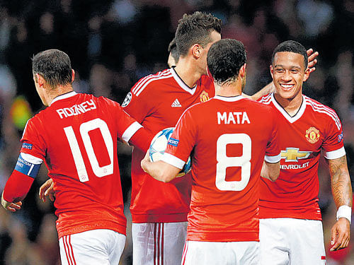 Manchester United's Memphis Depay (right) celebrates with team-mates after scoring on Tuesday. Reuters