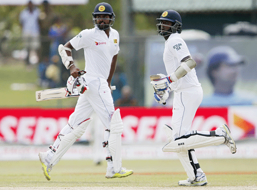 Sri Lanka's captain Mathews and Thirimanne run between wickets during the third day of their second test cricket match against India in Colombo. Reuters