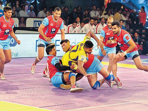 working his way up: Karnataka team skipper Sukesh Hegde (centre and inset), who turns out for Telugu Titans, in action during a Pro Kabaddi League match.