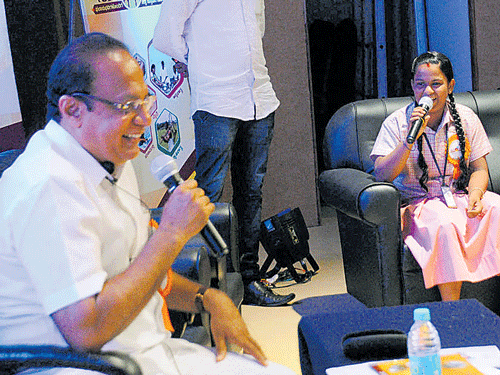 District-in-Charge Minister Vinay Kumar Sorake interacts with students at the Jana Mana programme in Udupi on Saturday. DH photo