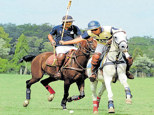 on the ball  Maj Shariq Ullah (right) of ASC in action against RVC during their semifinal in Bengaluru on Saturday. DH photo