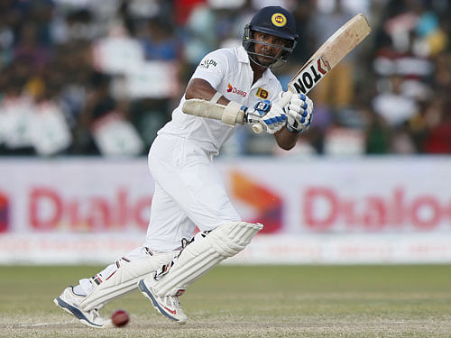Sri Lanka's Kumar Sangakkara hits a boundary during the fourth day of their second test cricket match against India in Colombo August 23, 2015. Sangakkara will resign from test cricket after second test cricket match with India. REUTERS