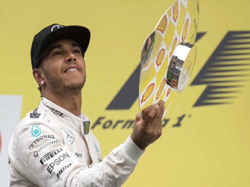 Mercedes Formula One driver Lewis Hamilton celebrates his victory in the Belgian F1 Grand Prix in Spa-Francorchamps. Reuters