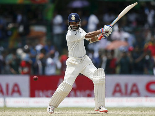 India's Ajinkya Rahane hits a boundary during the fourth day of their second test cricket match against Sri Lanka in Colombo August 23, 2015. Reuters Photo.
