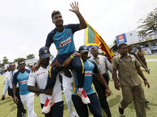 Sri Lanka's Sangakkara waves to his fans during his retirement ceremony after India won their second test cricket match against Sri Lanka in Colombo. Reuters File photo