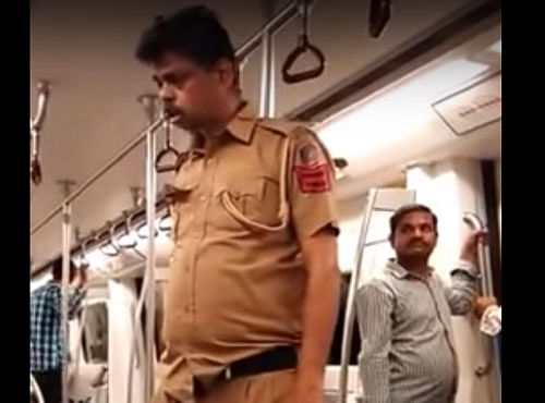 Drunk cop in Delhi Metro. Screen grab