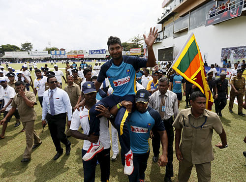 Sri Lanka's Sangakkara waves to his fans during his retirement ceremony after India won their second test cricket match against Sri Lanka in Colombo. Reuters photo