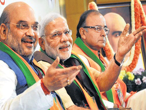 PM Narendra Modi with Fin Min Arun Jaitley and BJP President Amit Shah. File photo