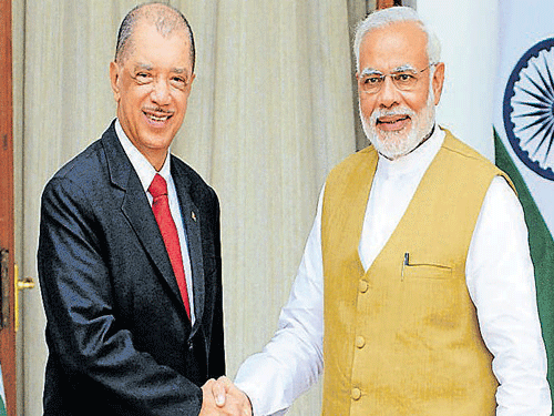 Prime Minister Narendra Modi greets President of the  Republic of Seychelles, James Alix Michel, before their  meeting in New Delhi on Wednesday. DH Photo