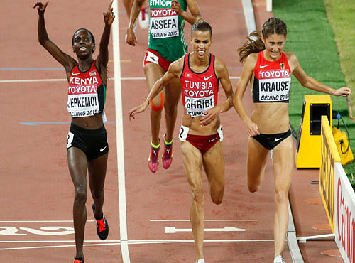 SUPER FINISH: Kenya's Hyvin Kiyeng Jepkemoi (left) finishes ahead of the second-placed Habiba Ghribi (centre) and third-palced Gesa Krause in the women's 3000M steeplechase final on Wednesday.