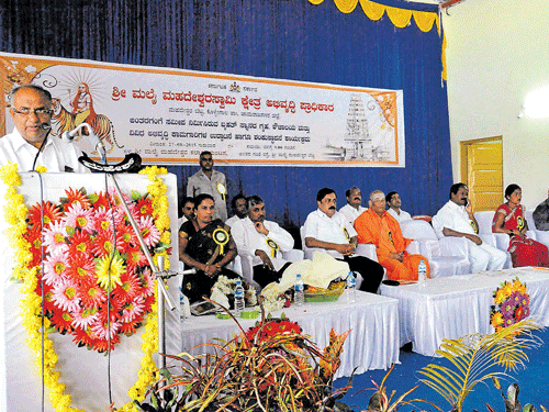 Cooperation and district in-charge Minister  H S Mahadev Prasad speaks after launching various development works, at Male Mahadeshwara Kalyana Mantap, near Hanur, Chamarajanagar district, on Thursday. DH photo