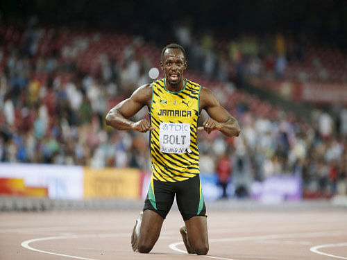 Usain Bolt of Jamaica celebrates after winning the men's 200m final during the 15th IAAF World Championships at the National Stadium in Beijing, China. Reuters