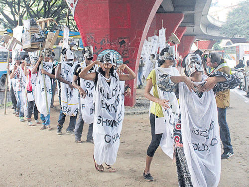 Participants performing a dance under the Shantinagar Flyover.