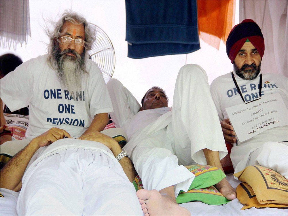 Ex-servicemen continue their indefinite hunger strike over non-implementation  of OROP in New Delhi on Thursday. PTI