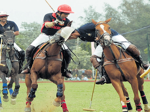 Close battle Maj Prithvi Singh (left) of ASC-Navy and Capt Aman Singh of 61 Cavalry-RVC in action on Friday. DH PHOTO