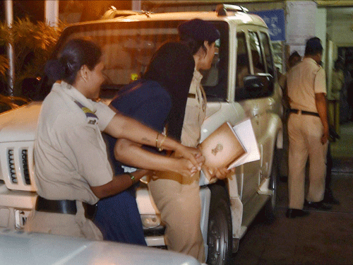 Indrani Mukerjea being taken to the Khar police station in Mumbai on Friday night. She was arrested allegedly in a murder case of her daughter Sheena Bora. PTI Photo