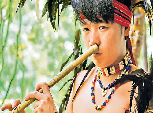 LILTING TUNES 'Tongali', a nose flute, being played by a Filipino.