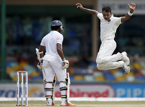 India's Binny celebrates after taking the wicket of Sri Lanka's Chandimal during the third day of their third and final test cricket match in Colombo. Reuters photo