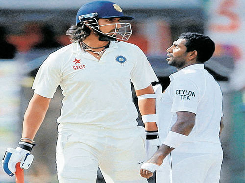 not quite cricket India's Ishant Sharma (left) and Sri Lanka's Dhammika Prasad confront each other on Monday. afp