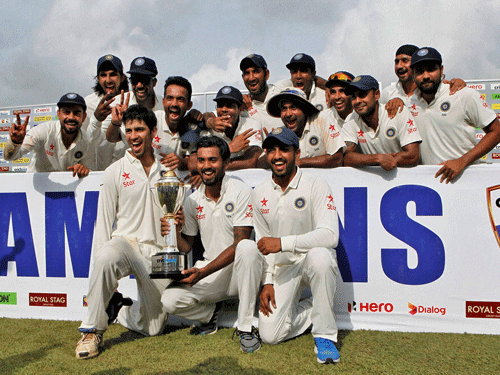 Indian cricketers pose with the trophy after they won the test cricket series against Sri Lanka in Colombo, Sri Lanka, Tuesday, Sept. 1, 2015. India won the third cricket test match by 117 runs and the series by 2-1. PTI