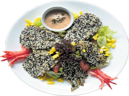 delectable Black and white sesame crusted fish with salad.