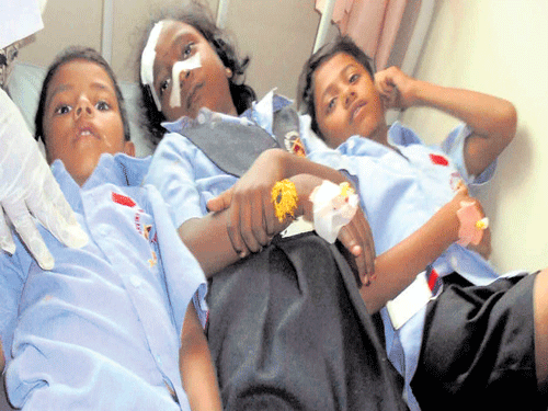 Three students of Arvind International School at Gowdarapalya in Kunigal taluk, Tumakuru district, who suffered injuries in boiler explosion, are being treated for burns at a hospital in Kunigal on Friday. dh pHOTO
