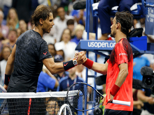 Fabio Fognini of Italy (R) shakes hands with Rafael Nadal of Spain (L) on day five of the 2015 U.S. Open tennis tournament at USTA Billie Jean King National Tennis Center. Reuters Photo