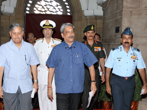 Defence Minister Manohar Parrikar with MoS Rao Inderjit Singh, Navy chief Admiral R K Dhowan, Army chief General Dalbir Singh Suhag and Air Chief Marshal Arup Raha arriving at South Block to announce the One Rank One Pension scheme, in New Delhi on Saturday. PTI Photo