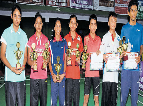 YOUNG CHAMPS (From left) Vaishnavi Reddy Jakka (girls' U-15 doubles), Pullela Gayatri (girls' U-15 singles & doubles and U-13 singles), Kavipriya S and Samiya Farooqui Imad (girls' U-13 doubles), Jayant Rana (boys' U-13 singles & doubles), Maisnam Meiraba (boys' U-13 singles & doubles) and Akash Thakur (boys' U-15 doubles), winners at the All-India Sub-junior ranking badminton tournament in Kalaburagi on Sunday. DH PHOTO