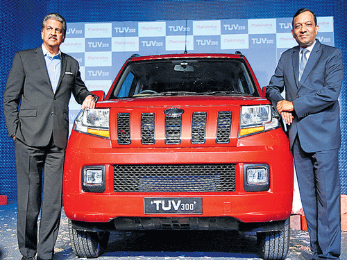 M&M&#8200;CMD Anand Mahindra (left) Executive Director Pawan Goenka launch the TUV300 in Chakan on Thursday.