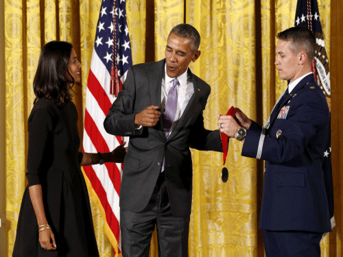 U.S. President Barack Obama presents author Jhumpa Lahiri with the National Humanities Medal during a ceremony at the White House in Washington. Reuters photo