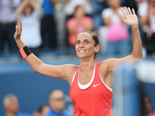 Roberta Vinci reacts after beating Serena Williams to reach the finals of the women's singles at the U.S. Open. Reuters photo
