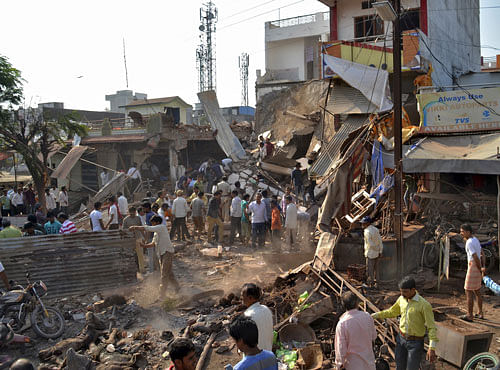 People at the site of an explosion in the Jhabua district of Madhya Pradesh on Saturday. REUTERS