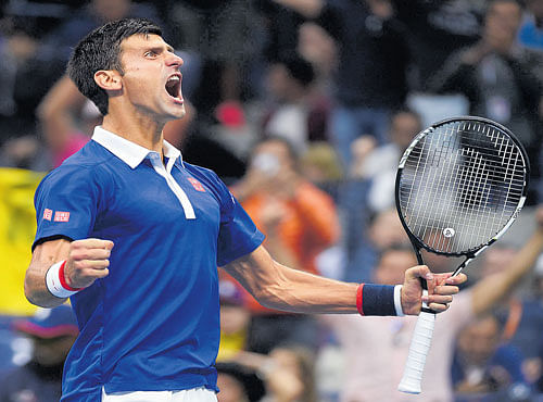 ROAR OF A WINNER: Novak Djokovic celebrates his four-set win over Roger Federer in the final of the US Open in NewYork on Sunday