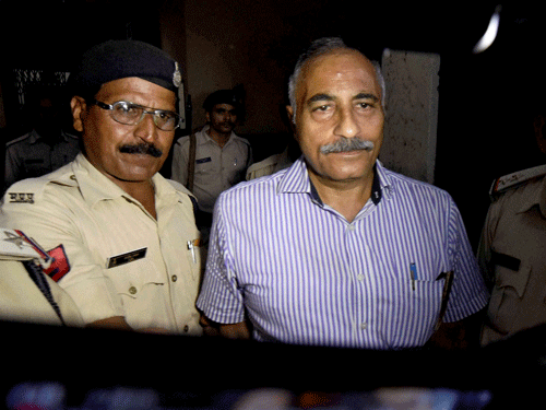 Suspended IAS officer Arvind Joshi is sent to jail after he surrendered before a court in Bhopal on Tuesday. PTI Photo