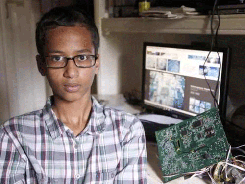 Mohamed kept the clock inside his school bag in English class but the teacher complained when the alarm beeped in the middle of a lesson following which he brought his invention up to show her afterwards. Image Courtesy Twitter.