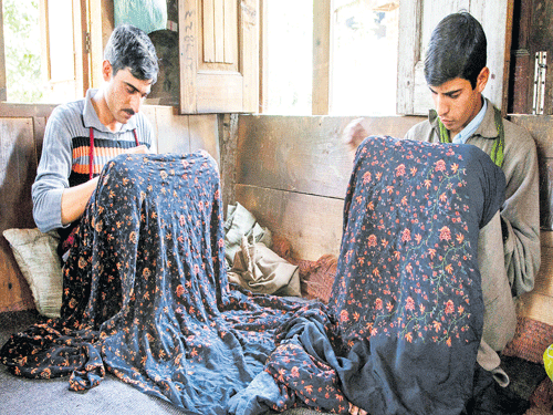 professionals by choice Men engaged in Sozni embroidery work in Kashmir. photo by Dinesh Khanna