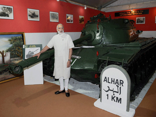 Prime Minister Narendra Modi with Pakistani M-48 Patton tank at 'Shauryanjali', a commemorative exhibition on Golden Jubilee of 1965 Indo-Pak war at India Gate in New Delhi on Thursday. PTI Photo