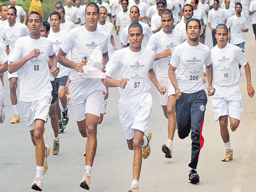 Participants give their best in the World Peace Marathon held on Sunday. dh photo