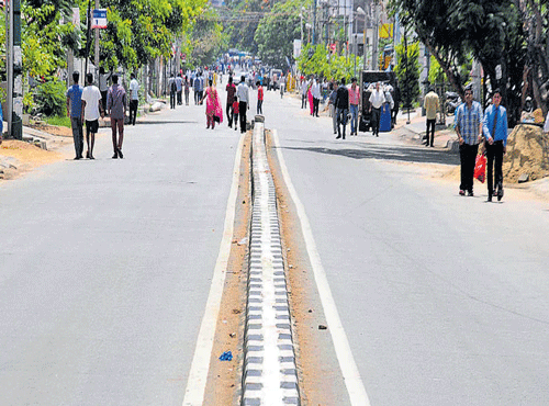 Senior citizens and patients had to walk long distance as cars were banned in HSR Layout on Sunday. DH PHOTO
