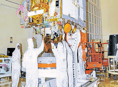 ISRO officials give final touches for the launch of Astrosat at the Satish Dhawan Space Centre, on Sunday. DH Photo