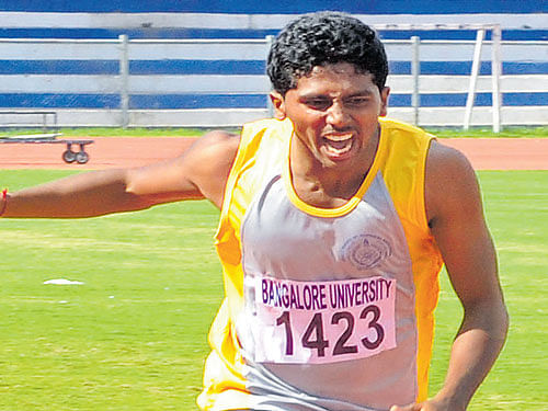 rapid strides Rahul D R of MES Degree College en route to the men's 400M gold in Bengaluru on Tuesday. DH photo