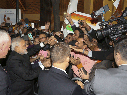 India's Prime Minister Narendra Modi greets well wishers after arriving at his hotel ahead of the 2015 General Assembly of the United Nations in Manhattan, New York. Reuters