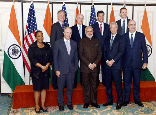 Prime Minister Narendra Modi poses before a meeting with officials of top Financial institutions in New York on Thursday. PTI Photo
