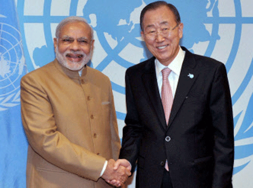 Prime Minister Narendra Modi shakes hands with United Nations Secretary-General Ban Ki-moon at the United Nations headquarters, in New York on Friday. PTI Photo
