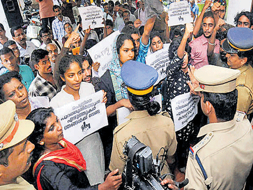 People protest at Kerala Sahitya Akademi, Thrissur, on Saturday over treatment meted out to writer Sreedevi Kartha. PTI