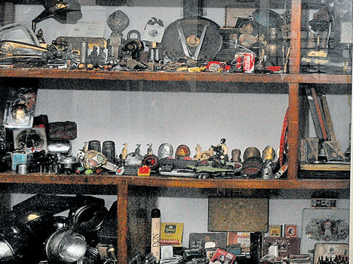 eclectic Vintage cycle spares, match boxes, cigars, lighters, porcelain dolls and other collectables.