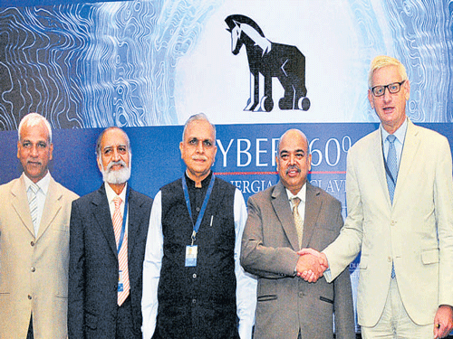 Additional Chief Secretary (Home) S K Pattanaik greets Global Commission on Internet Governance Chairman Carl Bildt at the Cyber 360 Synergia conclave in Bengaluru on Tuesday. (From left) Synergia Founder & Chairman Tobby Simon, Commissioner of Police (Bangalore City) N S Megharikh, CII National Committee on Digital India Mission Chairman Kiran Karnik, Deputy National Security Advisor Arvind Gupta, Research Director of International Security at Chatham House Patricia Lewis and Former Canadian deputy foreign minister Gordon Smith also attended the event. B K Janardhan